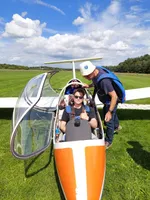 Thumbs up from the cockpit of a glider